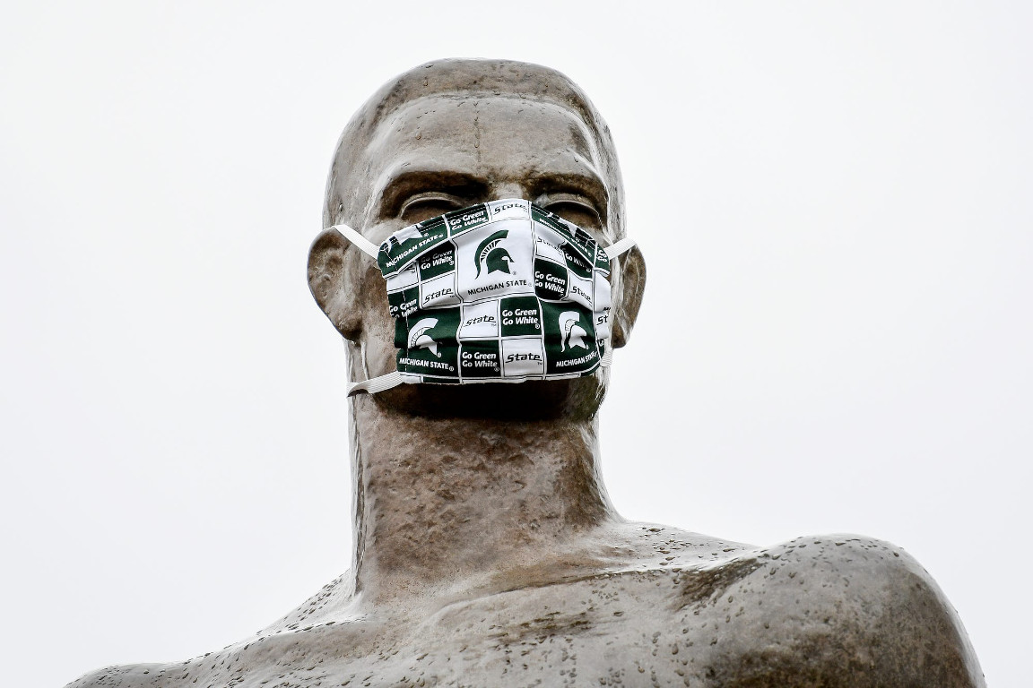 Photo of the MSU Spartan Statue sporting a MSU mask.