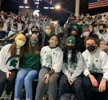 Photo of SGWC Mentors at a Spartan hockey game.